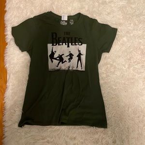 Dark green “The Beatles” shirt.